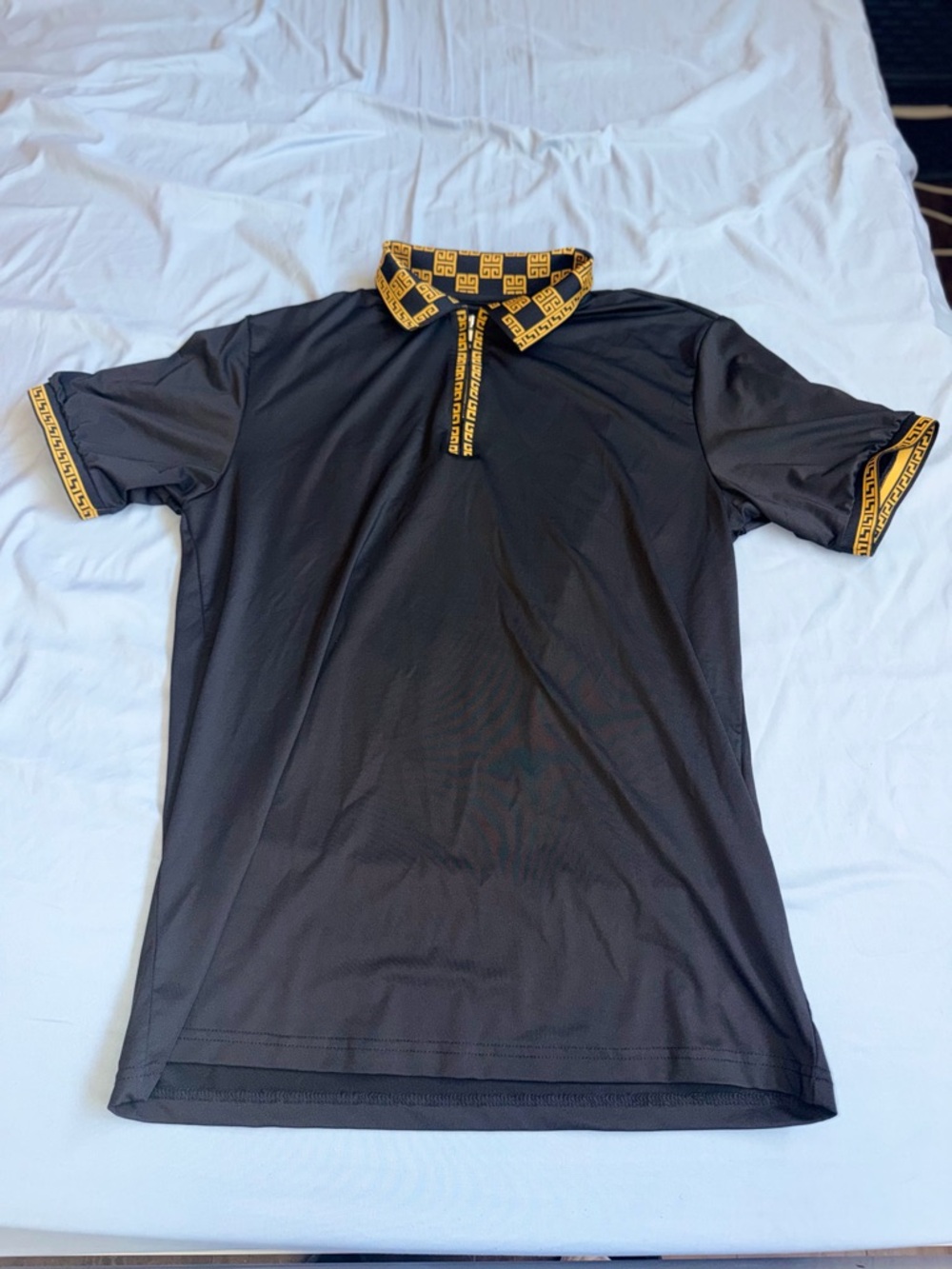 Men's Black Polo with Contrasting Gold-Patterned Trim